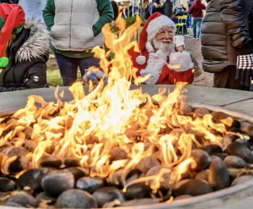 Santa relaxes by the fire